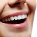 Il sorriso è (anche) una questione di genere